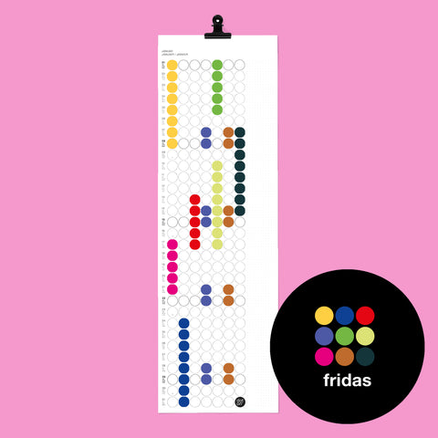 dot on weißer Monatsplaner Wandkalender mit Klebepunkten im Format 23x72 cm beklebt mit Klebepunkten in Frida Kahlo Farben und schwarzer Metallklammer