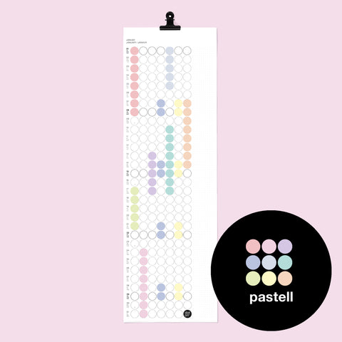 dot on weißer Monatsplaner Wandkalender mit Klebepunkten im Format 23x72 cm beklebt mit Klebepunkten in den Pastellfarben rosa, apricot, türkis, hellgelb, hellblau und schwarzer Metallklammer